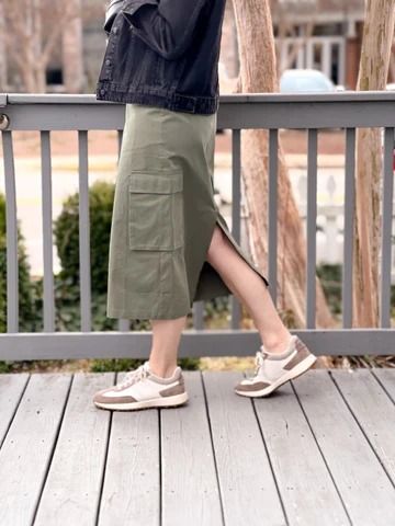 The Callen Cargo Skirt is the perfect blend of casual and chic, ideal for any adventure that comes your way. The cargo-style pockets add a playful twist. This skirt is the epitome of cool, making it the ultimate choice for fun and fashionable days ahead! Item Details: Midi Length Cargo Pockets Button Waist Closure Belt