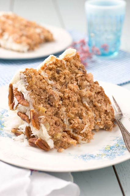 a slice of carrot cake on a plate with a fork