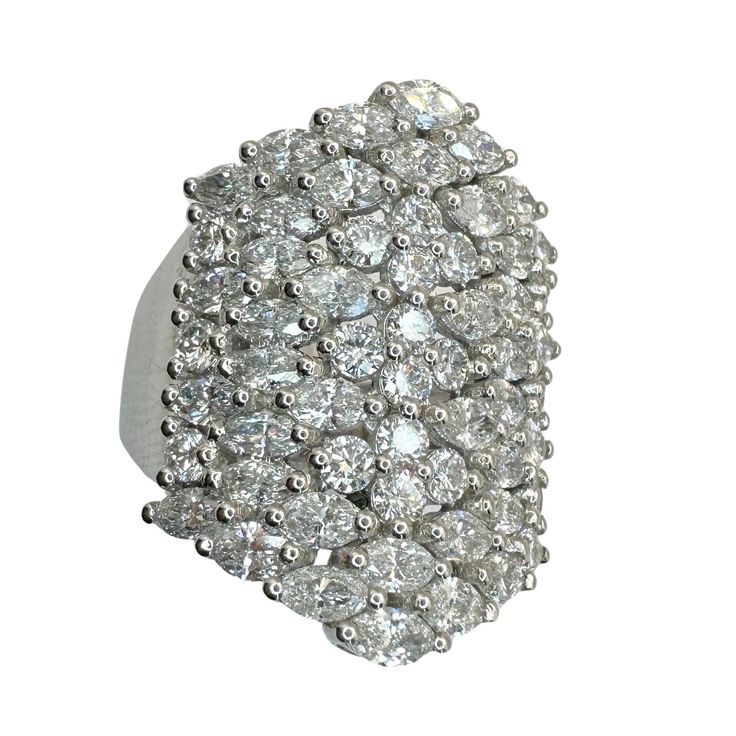 Indulge in luxury with this exquisite 18k Diamond Wide Band Ring. Crafted from 18k white gold, this ring boasts 4.10 carats of sparkling diamonds set on a 25.92mm wide band. With a ring size of 6.75 and a weight of 12.2 grams, this ring is sure to make a statement. In good condition with minor surface wear. 18k Diamond Wide Band Ring Condition: In good condition with some minor surface wear consistent with age. Ring size: 6.75 Width: 25.92mm wide Markings: "T1365" Metal: 18k White Gold Weight: 12.2 grams Diamonds: 4.10 carats Luxury White Cluster Ring With Baguette Diamonds, Luxury Cluster Cut Diamond Ring, Luxury Cluster Diamond Ring, Luxury Cluster-cut Diamond Ring, Luxury Cluster Diamond Ring With Single Cut Diamonds, Platinum Cluster Diamond Ring With Baguette Diamonds, Luxury Wide Band Diamond White Diamond Ring, Luxury White Gold Cluster Ring With Baguette Diamonds, Luxury Cluster Diamond Ring In Platinum