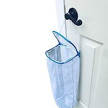 a white door with a blue mesh bag hanging from it's side and the words store, wash, dry