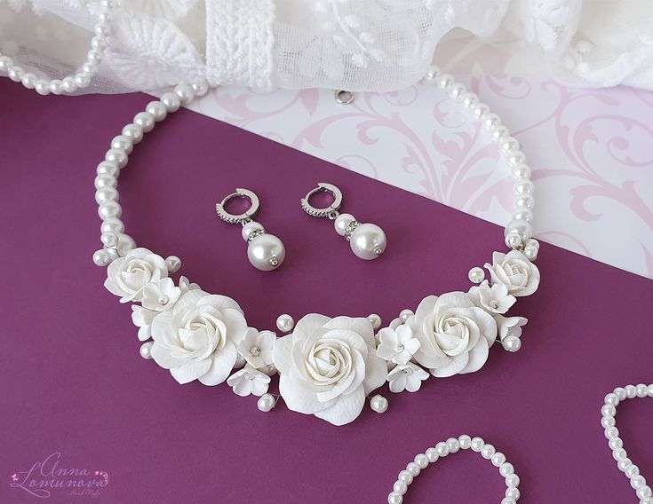 "White roses necklace Bridal jewelry set Wedding bib necklace Bridal flower necklace set White floral bridal necklace Pearl bridal jewelry White  floral statement necklace and earrings for the bride. This bridal jewelry set will wonderfully decorate a wedding dress and complete the look. This set with flowers and pearls looks very gentle on the bride. Flower rose, made of polymer clay. For these flowers I used high quality polymer clay Fimo. Each flower is made by hand in a special technique. Ci Elegant White Flower Jewelry Sets, White Flower Bridal Necklace For Wedding, Elegant Flower Shaped Wedding Jewelry Sets, Elegant Flower-shaped Wedding Jewelry Sets, White Floral Bridal Necklace For Wedding, Delicate Handmade Flower Jewelry For Wedding, White Wedding Jewelry With Flower Decoration, White Flower Decoration Wedding Jewelry, Floral Necklace For Wedding