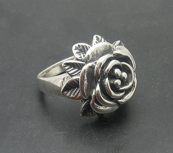 Sterling silver ring 925/1000, flower. Stamped 925.Approximate weight 10.0 grams. Top width 2.2cm (0.88 inches). All our jewels are made from solid sterling silver 925/1000 and are carefully crafted by hand in our family workshop. We dispatch your orders in 5 working days, worldwide and the postage is $5. We ship registered priority mail. Please allow 5-7 working days for delivery in Europe and 10-15 working days outside Europe. For any questions - please do not hesitate to contact me! Silver Flower-shaped Rings With Rose Design, Sterling Silver Rose Design Flower Ring, Formal Flower Ring Stamped 925, Formal Sterling Silver Flower Ring, Sterling Silver Flower Ring For Formal Occasions, Formal Flower Shaped 925 Silver Ring, Hallmarked Sterling Silver Flower Ring, Silver Flower Ring Stamped 925, Hallmarked Silver Flower Ring