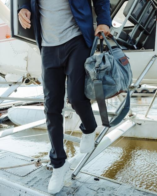 The perfect pants for trips where carry-on space is a luxury Casual Travel Pants With Pockets, Travel Bottoms With Pockets For Fall, Fall Travel Bottoms With Pockets, Casual Fall Travel Bottoms, Versatile Travel Pants With Functional Pockets, Casual Travel Pants With Functional Pockets, Casual Pants With Functional Pockets For Travel, Versatile Travel Pants With Side Pockets, Casual Commuting Pants With Pockets