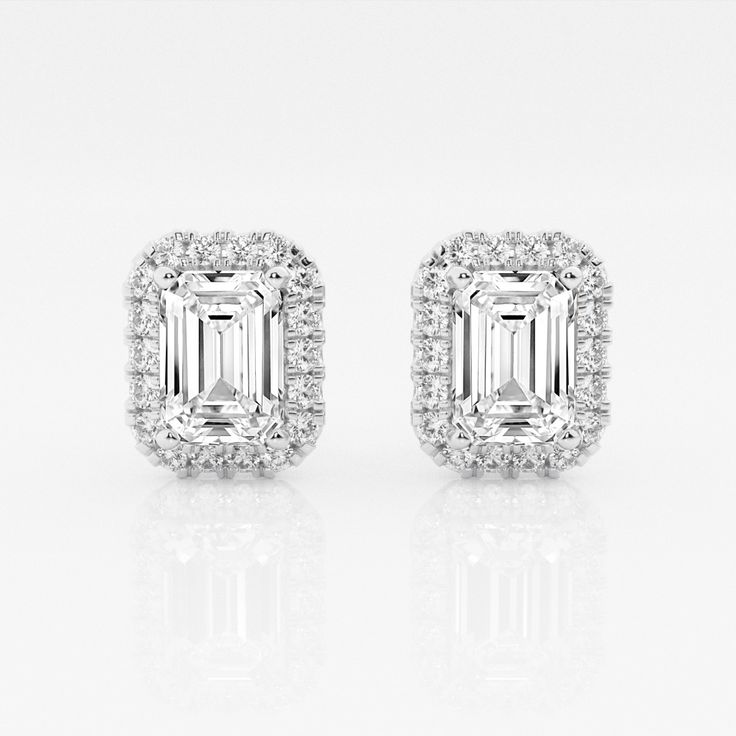 We can't keep these emerald stud earrings in stock. Styled with large emerald cut lab grown diamonds with a halo of round diamonds, these earrings are a true epitome of seductive glamor. Luxury Lab-grown Diamond Halo Earrings, Emerald Stud Earrings, Halo Diamond Earrings, Emerald Earrings Studs, Jeweled Earrings, Halo Earrings, Emerald Cut Diamonds, Diamond Halo, Halo Diamond