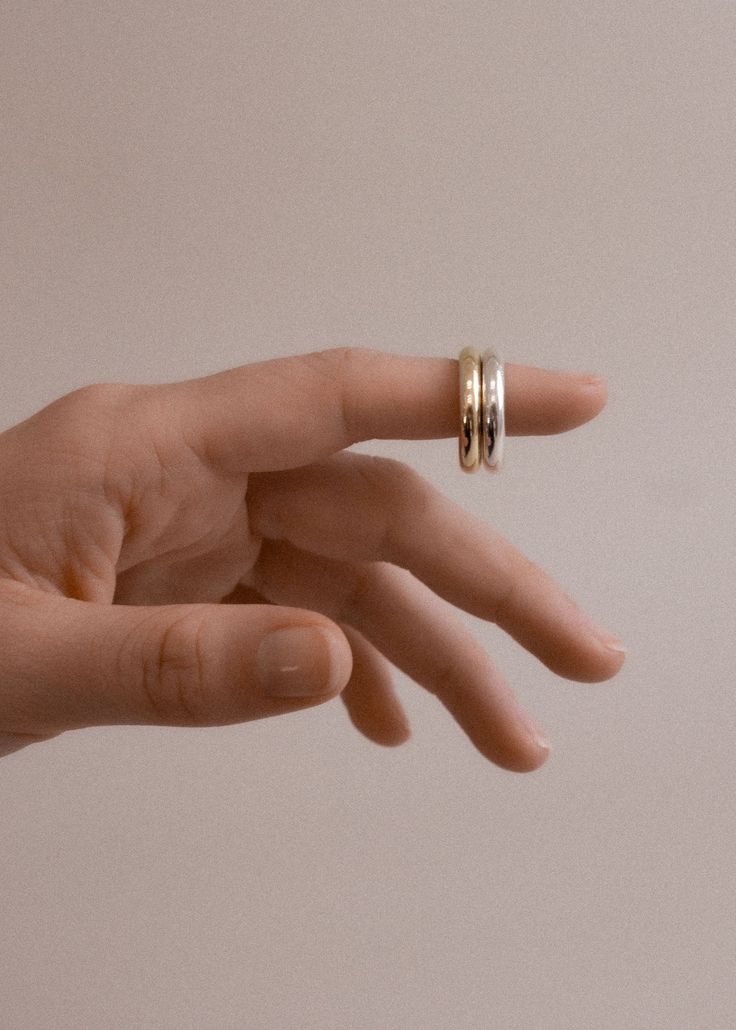 The Chunky Tube Ring is a modern Kinn classic. Both bold and subtle, it adds a touch of effortless elegance to any look. A true heirloom in the making, wear as a wedding band or as part of your everyday stack. 14k solid gold—always Average weight: 6.3g Width: 4mm Thickness: 2.74mm Non-hollow band Custom sizing is available. Custom sized pieces are final sale. This piece is made to order. Please allow at least 10-15 business days for production. Timeless Stackable Wide Band Ring For Anniversary, Minimalist Wide Band Stackable Jewelry, Heirloom Style Everyday Stackable Rings In Recycled Gold, Heirloom Stackable Rings, Tarnish Resistant, Everyday Heirloom Style Tarnish Resistant Stackable Rings, Heirloom Style Stackable Rings For Everyday, Heirloom Style Everyday Stackable Rings With Round Band, Heirloom Stackable Rings Everyday Round Band, Minimalist Wide Band In White Gold