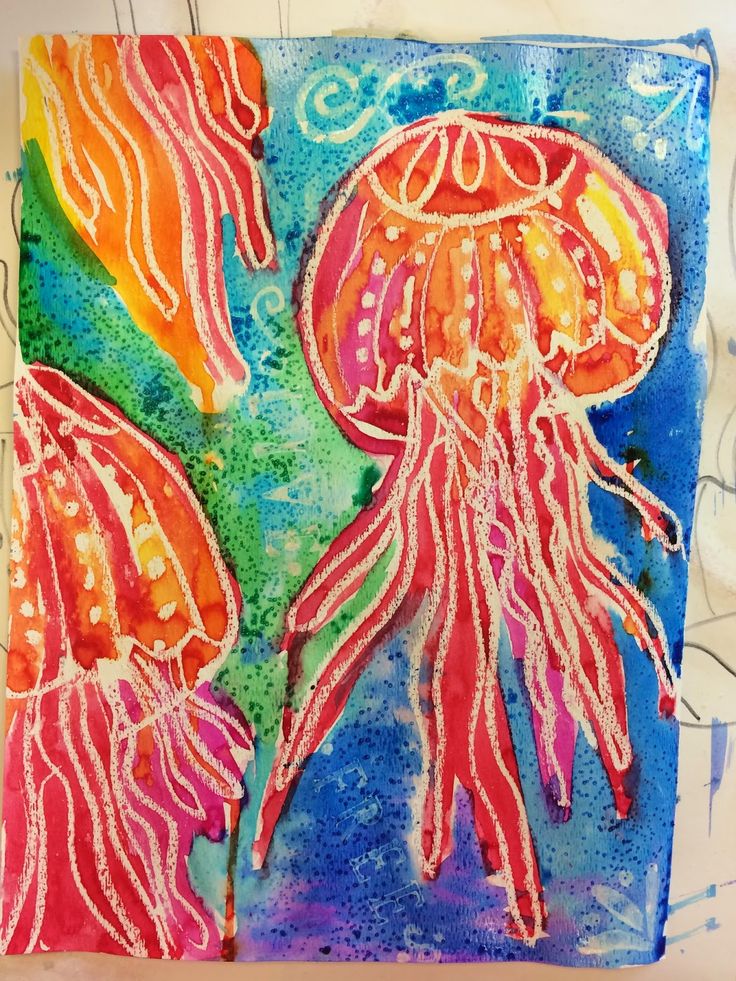 two jellyfishs are painted on a piece of paper