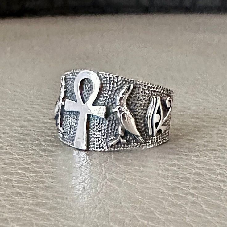 Handcrafted Solid Sterling Silver .925/ Ankh Ring 100% hand-polished solid sterling silver Approximated weight 7.4 grams Ankh ring properly crafted in solid 925 sterling silver with a 925 stamp on the inside. Ankh referred to as the key of life or the key of the nile--is representative of eternal life in Ancient Egypt. The ankh may also represent water, air, and the sun, which were meant to provide and preserve life in Ancient Egyptian culture.  All products here are GUARANTEED 925 Sterling Silver of finest standard. We offer a 30 day money back in our shop policies if you are not happy with the purchase. Customer experience is my first priority. I want you to feel happy with your purchase and love the item you choose. Every feedback were used to its full potential to better what I can pro Adjustable Silver Etched Signet Ring, Adjustable Etched Silver Signet Ring, Symbolic Silver Signet Ring Stamped 925, Spiritual Silver Rings With Polished Finish, Silver Engraved Open Ring Symbolic Style, Symbolic Silver Hallmarked Rings, Symbolic Sterling Silver Rings Stamped 925, Symbolic Ankh Ring As A Gift, Symbolic Ankh Rings For Gifts