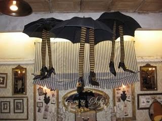 an umbrella is hanging from the ceiling in a room