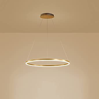 an empty room with a round light fixture hanging from the ceiling