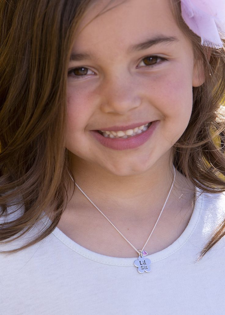 Adorable Sterling Silver "Lil Sis" daisy flower charm necklace with pink sparkling heart accent on a 14" Italian Chain. What a special gift for little sisters! Matching Big Sis Necklace also available for her big sister. Necklace comes in beautiful gift box that kids love. Mother's Day Adjustable Initial Pendant Charm Necklaces, Adjustable Initial Pendant Charm Necklaces For Mother's Day, Personalized White Necklace For Best Friend Gift, Personalized White Necklaces For Best Friend Gift, Cute Adjustable Necklaces For Best Friend Gift, Playful Nickel-free Jewelry For Birthdays, Playful Silver Charm Necklace For Birthday, Playful Nickel-free Jewelry For Birthday, Personalized White Charm Necklace For Best Friend Gift