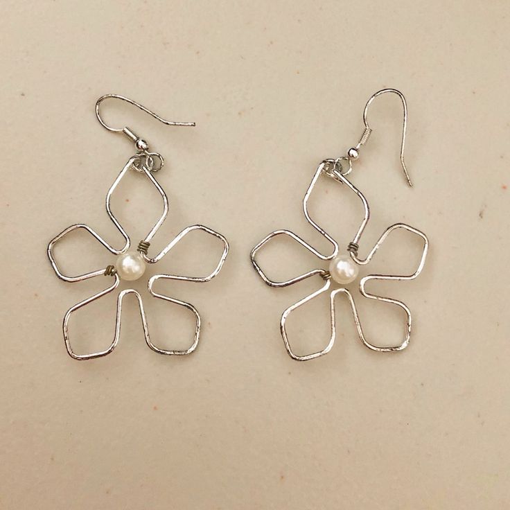 Silver Dangling Flower Earrings With Pearls. Never Worn. White Metal Flower Shaped Jewelry, White Metal Flower-shaped Jewelry, Trendy Metal Flower Shaped Earrings, Trendy Metal Flower Earrings, Trendy Metal Flower-shaped Earrings, White Metal Jewelry For Spring, Spring Flower Shaped Nickel Free Earrings, Trendy Silver Flower Earrings, Spring Flower-shaped Nickel-free Earrings