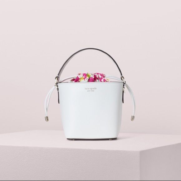 Kate Spade Pippa Small White Bucket Bag, Nwt. A Classic Silhouette, Miniaturized. One Of Our Most-Loved Styles, The Pippa Small Bucket Bag Is Now Crafted From Floral Denim. A Faille Lining W/ A Drawstring Closure Keeps Your Essentials Secure & Can Be Tucked In & Hidden. A Removable, Adjustable Strap Transforms This Little Carry-All Into A Cute Crossbody. Bucket Bag W/ Drawstring Closure Optional/Adjustable Shoulder Strap Floral Denim Faille Lining Enamel Spade 6"H X 5.5"W X 4.7"D Strap Drop 22" Designer White Bucket Bag With Top Carry Handle, Luxury White Bucket Bag With Top Handle, Luxury White Bucket Bag With Top Carry Handle, White Top Handle Bucket Bag For Travel, Luxury White Bucket Shape Shoulder Bag, White Bucket Bag For Evening, Luxury White Bucket-shaped Bag, Luxury White Bucket Bag, Luxury White Evening Bucket Bag