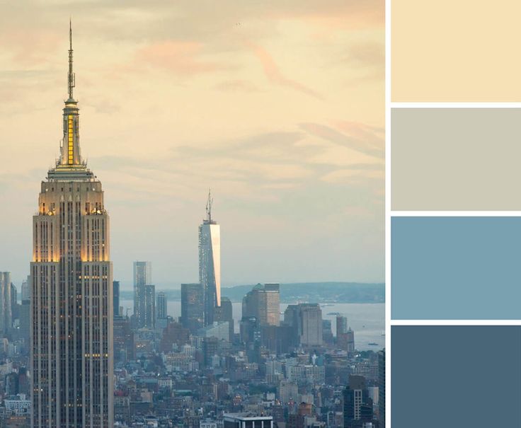 the empire building in new york city is lit up with yellow and blue hues