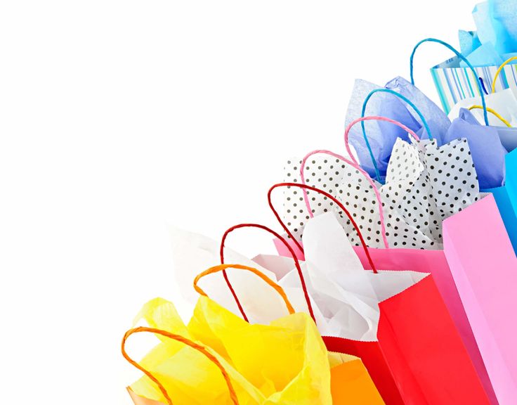 several colorful shopping bags are lined up together