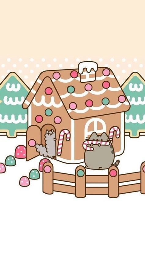 a cat sitting in front of a gingerbread house