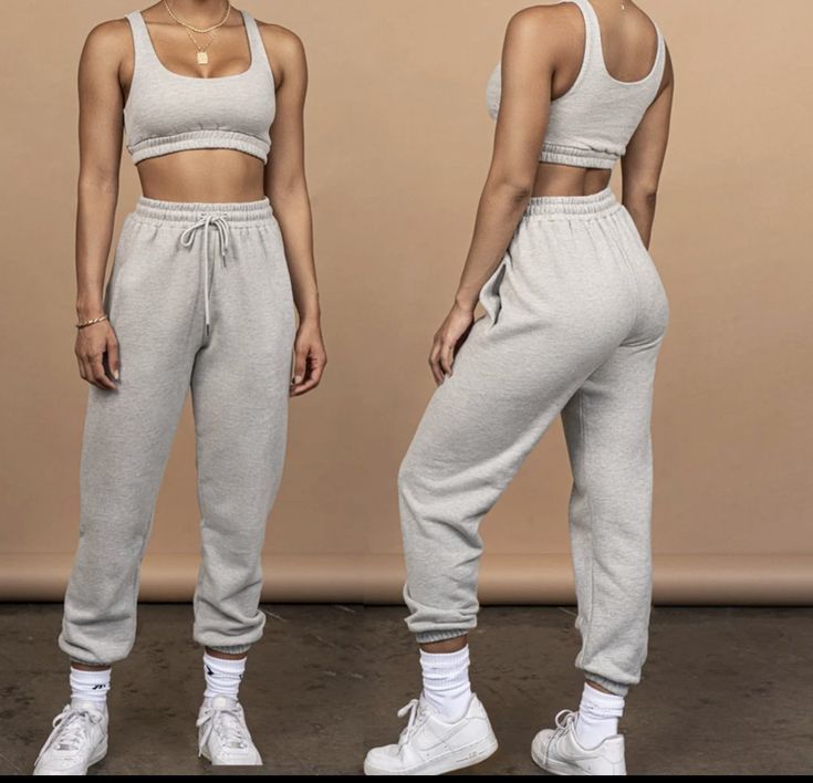 Take your off duty look the extra mile with this comfy set. Its a high quality jogger 2 piece crop top and pant set with an elastic waistband that we love, comfy for workout or just chilling and hanging out. Style with sneakers or heels to complete the look Athleisure Tracksuit With Elastic Waistband And Relaxed Fit, Trendy Sports Sweatpants With Elastic Waistband, Relaxed Fit Athleisure Tracksuit With Drawstring, Athleisure Tracksuit With Drawstring And Relaxed Fit, Trendy Stretch Joggers For Loungewear, Trendy Sports Joggers With Elastic Waistband, Sporty Tracksuit With Elastic Waistband And Relaxed Fit, Sportswear Tracksuit With Drawstring For Loungewear, Sportswear Tracksuit With Drawstring