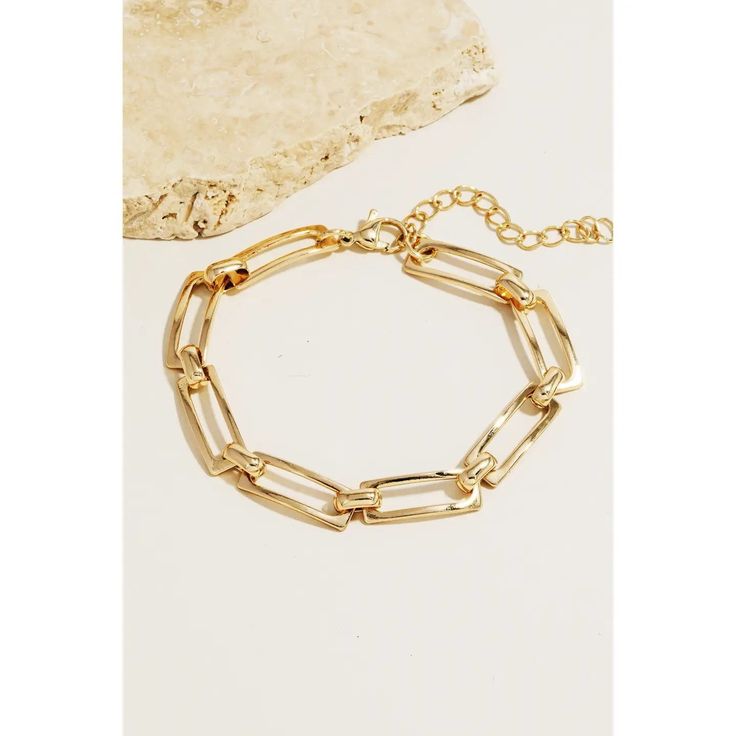 This piece is a true showstopper, this bracelet displays a unique metallic rectangle chain link design. This item is ideal for those who want to add some personality to their outfits without being too bold. 100% Stainless Steel Affordable Stainless Steel Rectangular Jewelry, Trendy Metal Jewelry With Rectangular Links, Trendy Metal Link Charm Bracelet, Trendy Metal Link Bracelets, Trendy Oval Link Metal Bracelets, Metal Bangle Chain Bracelet As Fashion Accessory, Chic Metal Paperclip Bracelet With Adjustable Chain, Chic Adjustable Bracelets With Paperclip Chain, Modern Gold Chain Bracelet Fashion Accessory