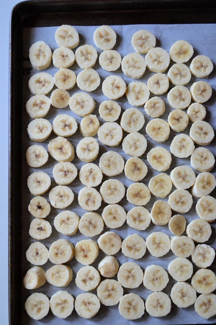 sliced bananas on a baking sheet ready to be cooked