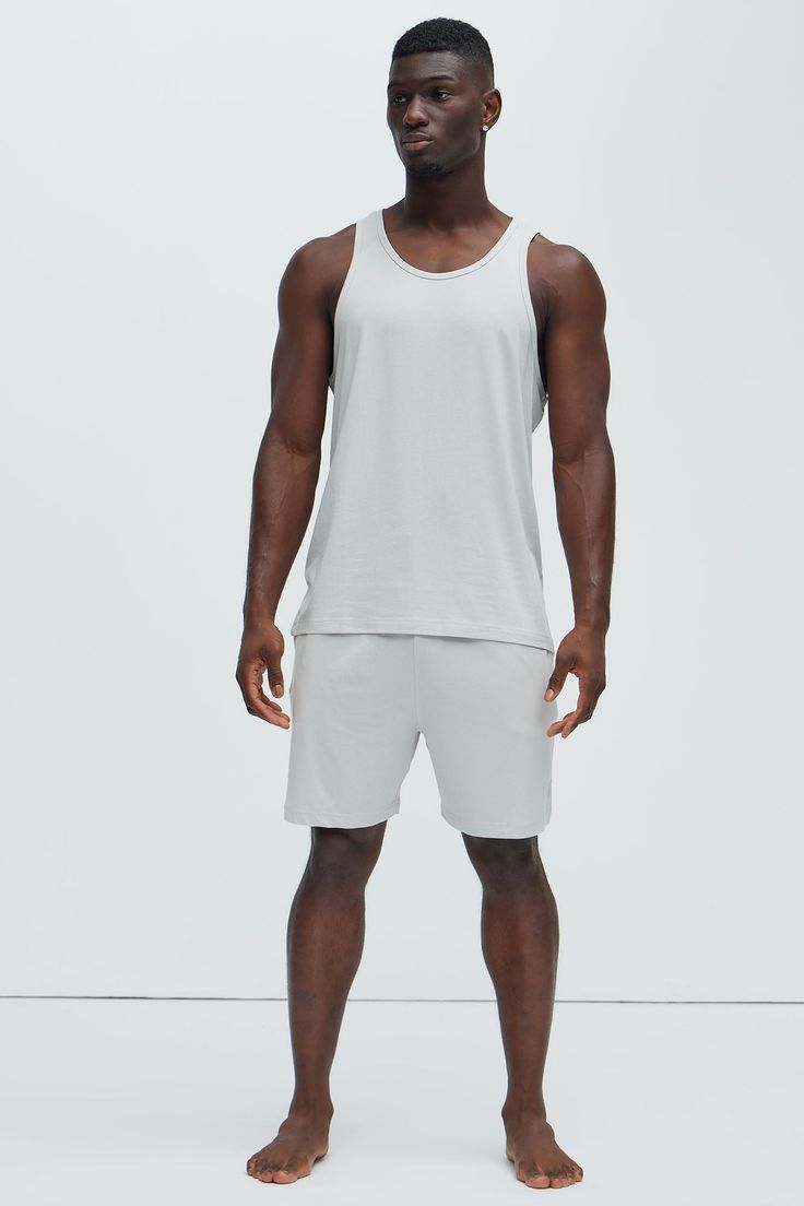 Available In Grey, Khaki, Black, Brown and Navy Scoop Neck Sleeveless 48% Cotton 47% Modal 5% Spandex Pair With "Essential Lounge Shorts" Pair With "Essential Lounge Pants" Imported | Mens Essential Modal Lounge Tank in Grey size Small by Fashion Nova Casual Sleeveless Elastane Activewear, Basic Stretch Tank Top For Summer, Sleeveless Go-dry Elastane Activewear, Basic Seamless Tank Top For Loungewear, Elastane Tank Top For Workout, Elastane Workout Tank Top, Sleeveless Moisture-wicking Activewear For Loungewear, Moisture-wicking Sleeveless Activewear, Gray Seamless Summer Activewear