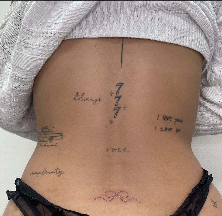 the back of a woman's stomach with writing on it