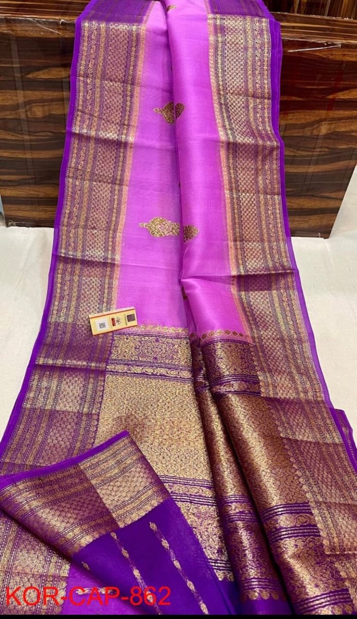 1.this is beautiful kora banarasi sari with running blouse piece 2.this sari is 5.5 mt length  3.this is a very elegant looking sari for all occasions like weddings and other formal events 4.fall n pico is complimentary  5.blouse can be made as per the requirements of the clients with proper measurements.stiching charges will be extra  6.plz check the availability of the sari before placing the order Traditional Zari Work Slub Silk Wear For Puja, Traditional Slub Silk Wear With Zari Work For Puja, Gold Art Silk Dupatta With Tilla, Pink Banarasi Silk Saree With Tilla Detailing, Festival Saree With Tilla Details, Pink Art Silk Saree With Tilla Detail, Festival Saree With Tilla For Rituals, Bollywood Cutdana Blouse Piece For Rituals, Bollywood Style Cutdana Blouse Piece For Rituals