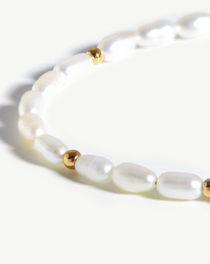 Seed Pearl Beaded Bracelet | 18ct Gold Plated/Pearl. Inspired by Natural Forms. Bringing Wisdom and Knowledge, Freshwater Seed Pearls Form this Unique Bracelet, Contrasted and Offset with Small Gold Beads for a Distinctive Finish. The Ultimate Way to Add Texture to Your Arm Stack. Metal: 18Ct Gold Plated on Brass Gemstone: Freshwater Seed Pearls Pearl Dimensions: 3. 5mm X 6mm Total Length: s - 185mm with Continuous Extension Starting at 160mm. M - 215mm with Continuous Extension Starting at 190m Akoya Pearl Charm Bracelet With Round Beads, Akoya Pearl Bracelet With Round Beads And Pearl Charm, Akoya Pearl Bracelet With Round Pearl Drop Beads, Baroque Pearl Bracelet With Round Beads And Pearl Charm, Akoya Pearl Bracelet With Pearl Drop, Akoya Pearl Drop Bracelet With Round Beads, Baroque Pearl Bracelet With Pearl Charm, Rondelle Pearl Bracelet As Gift, Rondelle Pearl Bracelet Gift