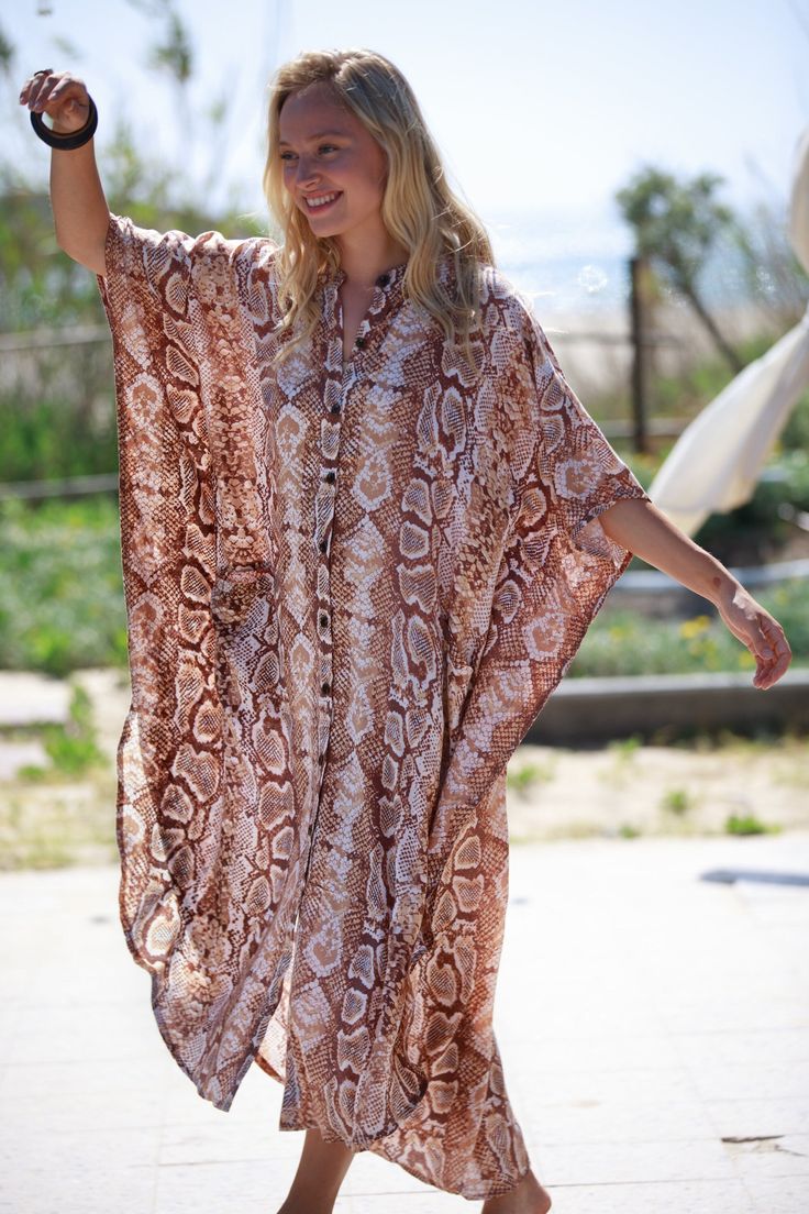 "This Oversize kaftan dress is the best choice for the summer and can be transformed for any occasion from casual to Special Occasion, day-to-night. The Dress is made of rayon, which is very lightweight and flowy.  It has lots of style and presence and feels so cool and chic. It is guaranteed to turn heads around... :) Fits all sizes - up to XXL and looks great on any body type. The Dress has pockets, and buttons, and is made of Rayon. COLOR - Snakeskin (Beige and Brown tones) Also Available in - 7 more prints! for example -  Blue and White Stripes - https://www.etsy.com/listing/728071093/ Brown Leopard Print - https://www.etsy.com/listing/728070405/ SIZE: Available in One Size - Up to 48.5\" (123 cm) bust and hips. Length - front 49.5\" (126 cm), back 54\" (138 cm) ⊱I ship your item/s wit Brown Long Maxi Dress For Beach Cover-up, Long Brown Kaftan For Summer, Long Brown Summer Kaftan, Summer Brown Kaftan For Beach Cover-up, Summer Beach Cover-up Brown Kaftan, Brown Long Kaftan For Beach Cover-up, Summer Brown Kaftan For Beach, Oversized Short Sleeve Kaftan For Festivals, Festival Oversized Short Sleeve Kaftan