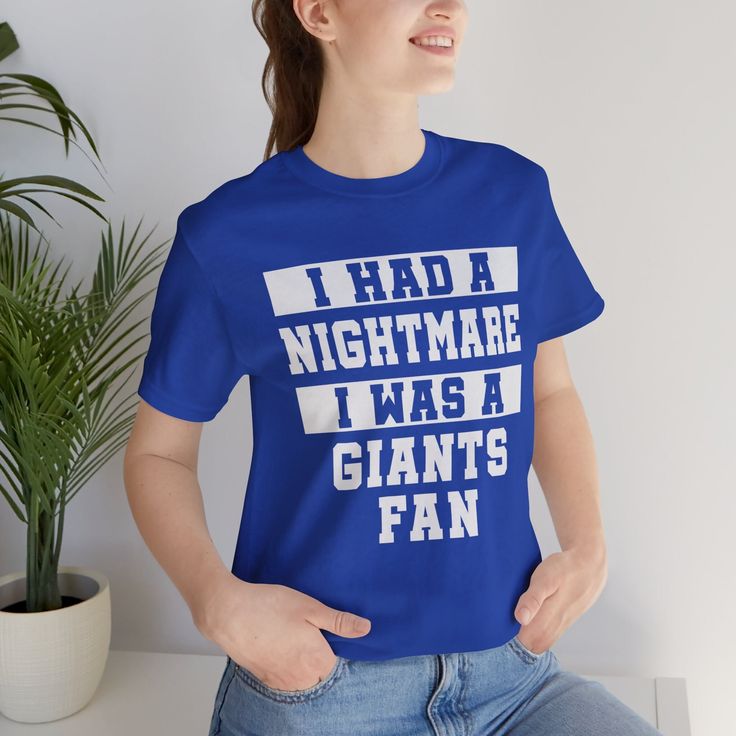 "Talk about terrifying...I had a Nightmare I was a Giants fan! Fun tee is perfect for the Los Angeles Dodgers fan to take a gentle poke at those Giant fans. Nightmare Giants Fan Tee will make for a great everyday t-shirt. It's made of a light-weight cotton, and very soft. The double stitching on the neckline and sleeves add more durability to what is sure to be a favorite! In orange, black, or athletic heather. Unisex t-shirt for men and women. Solid colors are 100% ringspun cotton. Athletic Hea Fandom T-shirt With Text Print, Fandom Screen Print Tops For Fan Gatherings, Fan Apparel T-shirt With Crew Neck For Fan Events, Fan Apparel T-shirt With Crew Neck For Events, Fandom Style T-shirt With Screen Print For Fan Gatherings, Sports Fan Tops With Letter Print For Fan Events, Funny Text Tops For Fan Merchandise, Fandom T-shirt With Letter Print For Fan Conventions, Fandom Short Sleeve Tops For Fan Gatherings