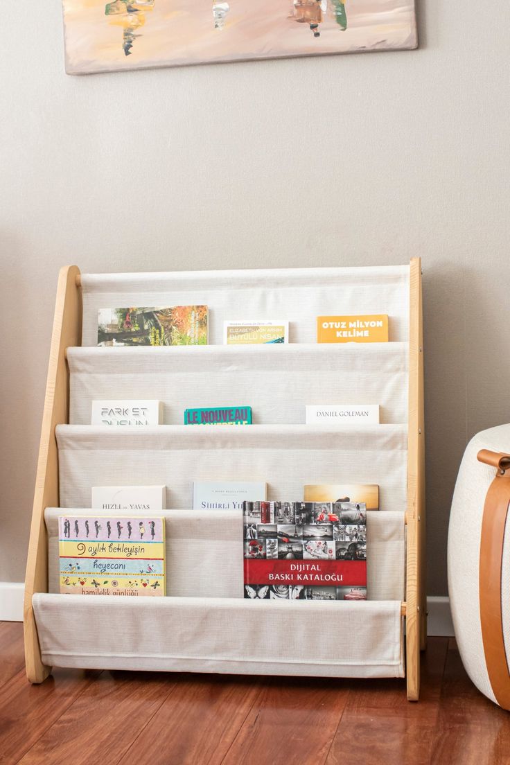 a white book shelf with books on it