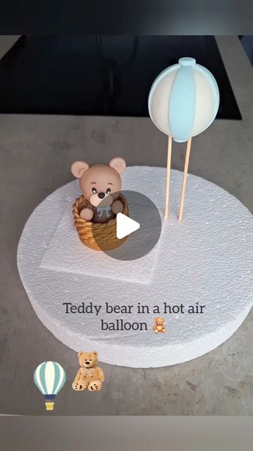 there is a teddy bear in a hot air balloon on the table with other toys