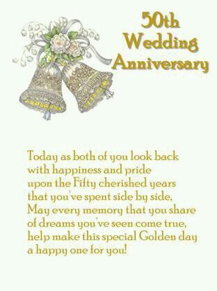 an anniversary card with two bells and flowers