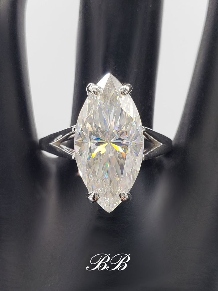 an oval cut diamond set in a white gold ring