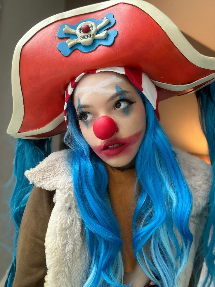 a woman with blue hair and clown makeup