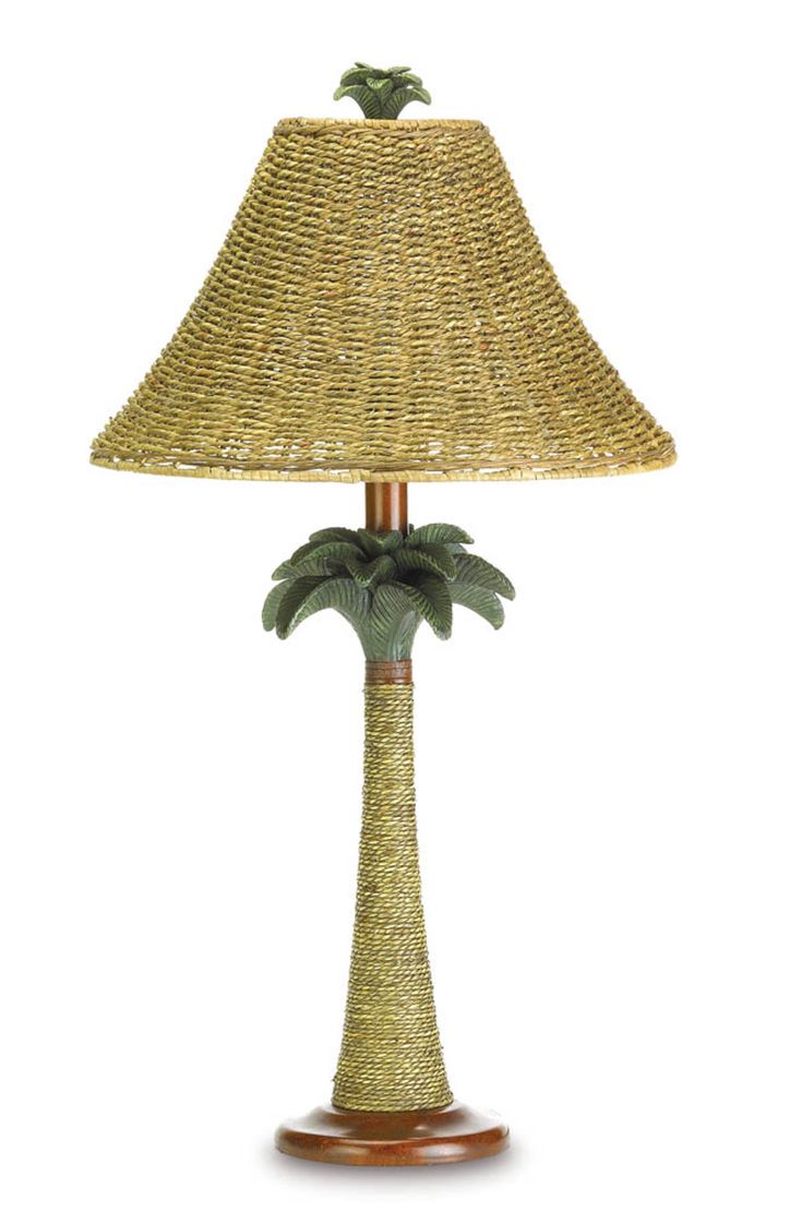 a lamp that has a palm tree on the base and is made out of wicker