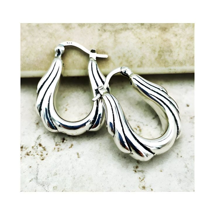 Elevate your jewelry collection with these exquisite 925 Sterling Silver Wave Design Hoop Earrings. Each earring boasts a mesmerizing wave pattern that captures the essence of elegance with a modern twist. The latch-back closure ensures a secure and comfortable fit, perfect for all-day wear. Crafted with precision, these earrings are hollow-formed, making them incredibly lightweight and easy on your ears. Measuring approximately 1 inch in both length and width, they offer a delightful presence without being overpowering. The stamp of 925 is your assurance of quality sterling silver, renowned for its durability and luster. Whether you're dressing up for a special occasion or accenting your everyday style, these hoops are sure to add a touch of sophistication and charm to any outfit. They're Sterling Silver Teardrop Huggie Earrings For Formal Occasions, Formal Teardrop Sterling Silver Huggie Earrings, Sterling Silver Teardrop Huggie Earrings In White Gold, Silver Teardrop Huggie Earrings For Anniversary, Teardrop Sterling Silver Huggie Earrings In White Gold, White Gold Sterling Silver Teardrop Huggie Earrings, White Gold Teardrop Huggie Earrings In Sterling Silver, Sterling Silver Teardrop Hoop Earrings With Polished Finish, Handmade Elegant Hoop Huggie Earrings