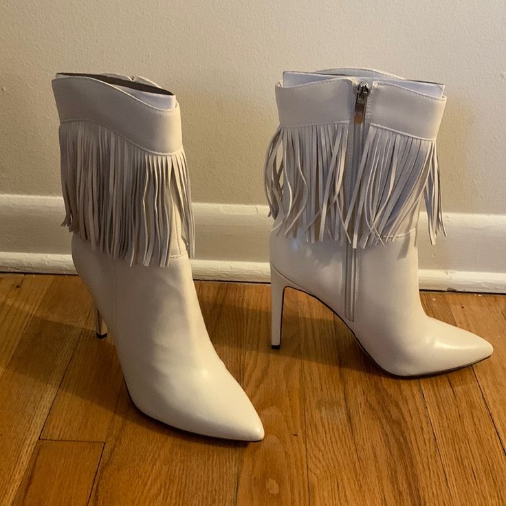 Brand New, Never Worn 7.5 Tries Heeled Fringed Ivory Booties. Fringe All Around Boots With Silver Zipper. 4 Inch Heel Height. Will Ship With Box White High Heel Boots For Spring, White Medium Width Closed Toe Heeled Boots, Chic White Closed Toe Heeled Boots, White Boots With 4-inch Heel And Round Toe, White Pointed Toe Heeled Boots With Medium Width, Cream Closed Toe Booties For Fall, Cream Ankle Booties For Spring, Fall Cream Closed Toe Booties, Chic Off-white Pointed Toe Boots