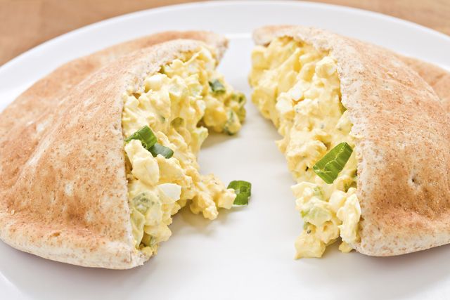 an omelet is cut in half on a plate