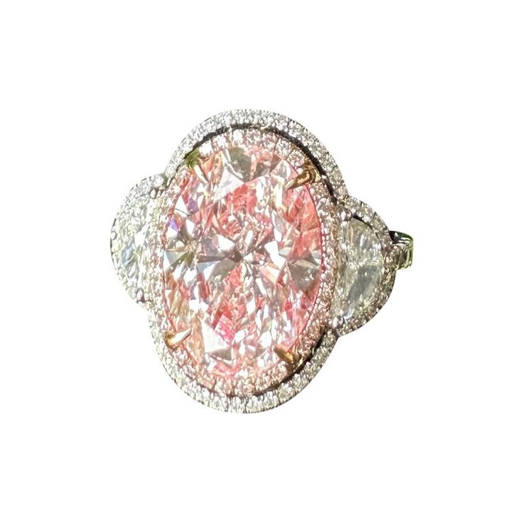 a fancy ring with pink and white diamonds