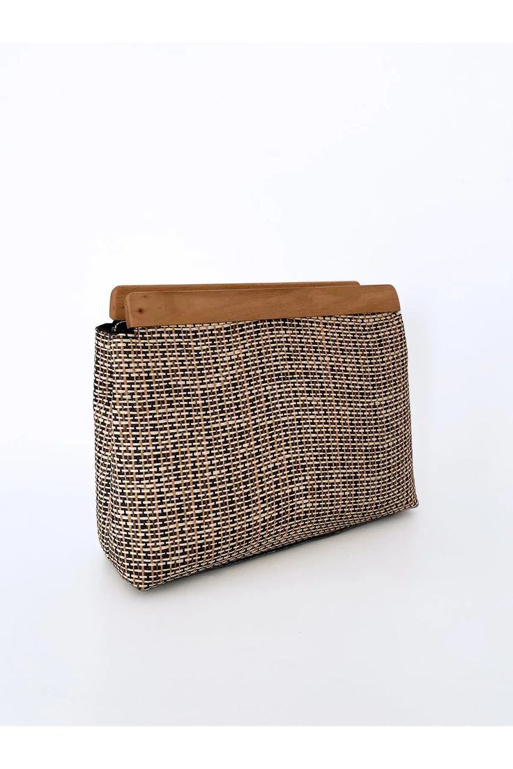 Introducing the uniquely charming Wooden Detail Striped Jute Straw Clutch from Lunarity Garage! This stylish clutch is a fusion of natural elegance and contemporary design, creating a one-of-a-kind accessory that will capture hearts and turn heads.Crafted with utmost care and creativity, the Wooden Detail Striped Jute Straw Clutch features a delightful blend of jute and straw with a chic striped pattern. The wooden detail, made of rich walnut wood, adds a touch of rustic allure, making it a true Modern Beige Clutch For Daily Use, Modern Beige Clutch For Everyday Use, Versatile Beige Rectangular Clutch, Everyday Brown Clutch For Summer, Versatile Rectangular Beige Clutch, Trendy Natural Clutch, Chic Everyday Clutch In Natural Color, Chic Natural Clutch For Daily Use, Versatile Brown Rectangular Clutch