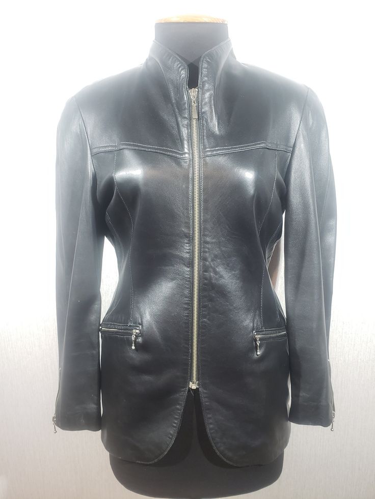 Stylish women's black leather jacket made of genuine leather. Reliable women's black jacket with a zipper. The jacket is made of strong, soft black genuine leather. The jacket is easily fastened with a metal zipper. The jacket has reliable pockets with metal zippers at the bottom and one in the middle. Jacket cuffs with metal zippers. The jacket has a nice polyester lining with artificial insulation. The design of the jacket combines a sporty and classic style, which allows you to use the jacket Formal Fitted Leather Jacket With Zip Fly, Elegant Leather Jacket With Zip Fly, Fitted Leather Jacket In Soft Leather, Fitted Leather Biker Jacket For Formal Occasions, Fitted Biker Leather Jacket For Formal Occasions, Elegant Fitted Biker Jacket With Zip Fly, Fitted Soft Leather Jacket, Fitted Leather Jacket With Zipper Closure For Business, Elegant Black Outerwear With Zipper Closure