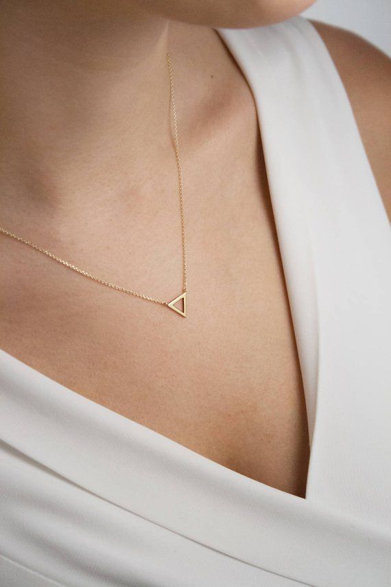 For all of you geometry lovers, we are proud to present: The triangle! A minimal necklace easy to wear for any occasion! Simple, classy and chic! What? Isnt geometry your thing? Thats fine. Just imagine layered necklaces! --Fairy Goldcharm ★★★★★★★★★★★★★★★★★★★★★★★★★★★★★★★★★★ Layering Minimalist Geometric Necklaces For Everyday, Elegant Triangle Everyday Jewelry, Minimalist Geometric Jewelry In 14k Gold, Minimalist Geometric 14k Gold Jewelry, Elegant Geometric Necklace For Everyday Wear, Elegant Geometric Necklace For Everyday, Minimalist 14k Gold Geometric Jewelry, Elegant Everyday Geometric Necklace, Elegant Triangle Necklace For Gifts