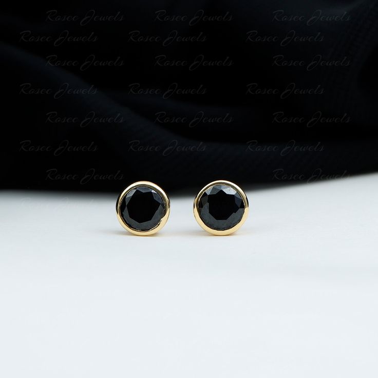 Product Details Simplicity meets elegance in these stunning Created Black Diamond Stud Earrings, delicately set in a Bezel Setting. The created black diamond gemstone exudes sophistication, making them a perfect accessory for any formal occasion. These classic solitaire stud earrings are a timeless addition to your jewelry collection. Product Information SKU SHP-EARRINGS102210003 Weight 0.96 gm LAB CREATED BLACK DIAMOND INFORMATION No.of Stones 2 Pieces Total Weight 1.68 Carat Dimension(approx) Black Diamond Earrings Studs, Black Diamond Solitaire, Black Diamond Studs, Solitaire Studs, Diamond Stud Earrings, Diamond Stud, Stud Earring, Diamond Earrings Studs, Diamond Gemstone