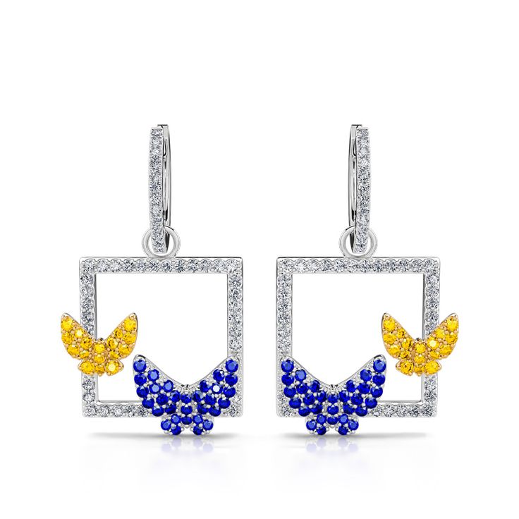 Glistening and glamorous, this pair of butterfly earrings will win your heart. Crafted in sterling silver, each features one blue butterfly and one yellow butterfly for endless charming. The perfect everyday earring for any butterfly lover, shine and sparkle in these earrings. These butterfly earrings are the perfect reminder to be free and adventurous like a butterfly, take some time to enjoy life. Each butterfly earring is a must-have for anyone wanting to add a sparkle to their outfit!Carat W Yellow Sterling Silver Single Earring, Fine Jewelry Butterfly Shaped For Pierced Ears, Sterling Silver Butterfly Charm Earrings, Sterling Silver Jewelry With Butterfly Charm Drop Earrings, Sterling Silver Drop Earrings With Butterfly Charm, Butterfly Shaped Fine Jewelry Earrings For Gifts, Butterfly Shape Fine Jewelry Earrings For Gift, Butterfly Shaped Fine Jewelry Earrings, White Gold Butterfly Charm Earrings