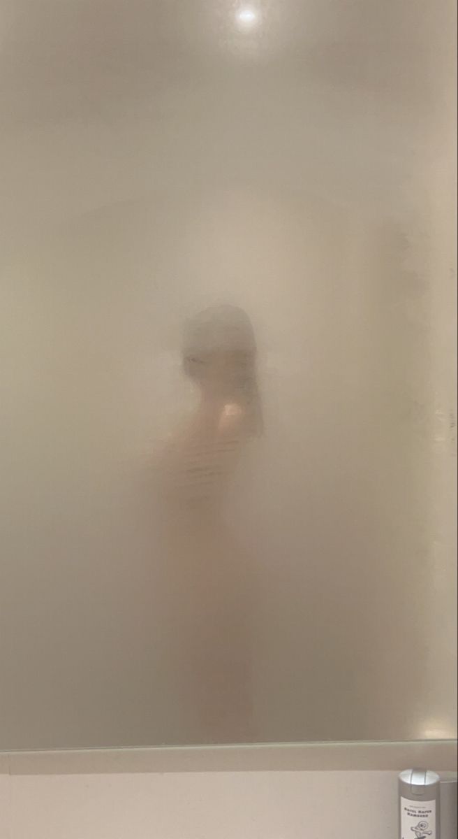 a blurry image of a person standing in the fog