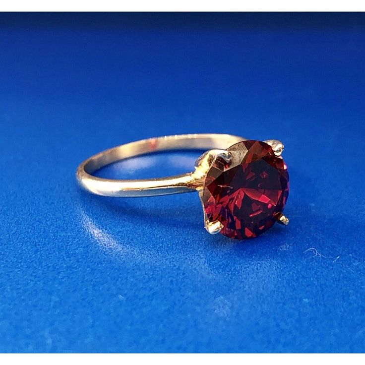 * Vintage Designer 14k Yellow Gold Round Red Quartz Solitaire January Ring * Ring Size: 6.0 * Top Of Ring Measures: 3/8" X 3/8" * Height: 3/8" * Band Measures: 1/16" * Red Quartz Total Carat Weight: Approximately 1.80 Tcw * Weight: 2.3 Tgw * Marked: 14k*Makers Mark * Condition: Great * G1059 Classic Red Ruby Jewelry, Classic Red Jewelry As A Gift, Classic Red Gemstone Jewelry, Classic Garnet Birthstone Ring In Yellow Gold, Yellow Gold Garnet Solitaire Jewelry, Classic Yellow Gold Garnet Birthstone Ring, Classic Red Birthstone Jewelry, Classic Red Jewelry With Lab-created Ruby, Classic Red Lab-created Ruby Jewelry