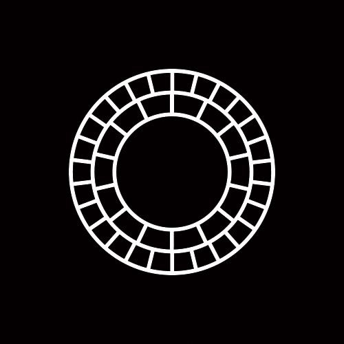 a black and white circular design on a dark background