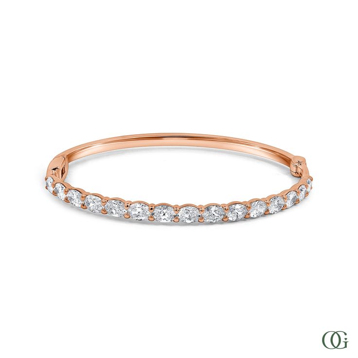 This Oval Diamond Bangle features an exquisite oval-shaped diamond set in a timeless design. Perfectly suited for any occasion, this stunning piece is sure to be treasured for years to come. The standard size is 7 inches; please note any other sizes are considered special order and may require additional time for production. Petite Engagement Ring, Diamond Bangle, Diamond Set, Dainty Earrings, Emerald Diamond, Oval Diamond, Antique Rings, Eternity Bands, Earring Gifts