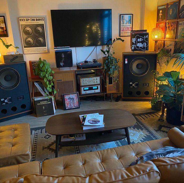 a living room filled with furniture and speakers