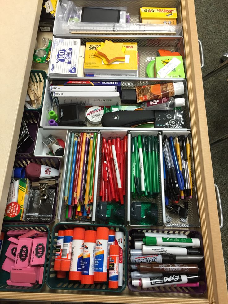 an organized drawer filled with pens, pencils and markers