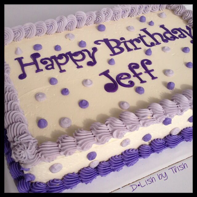 a birthday cake with purple and white frosting